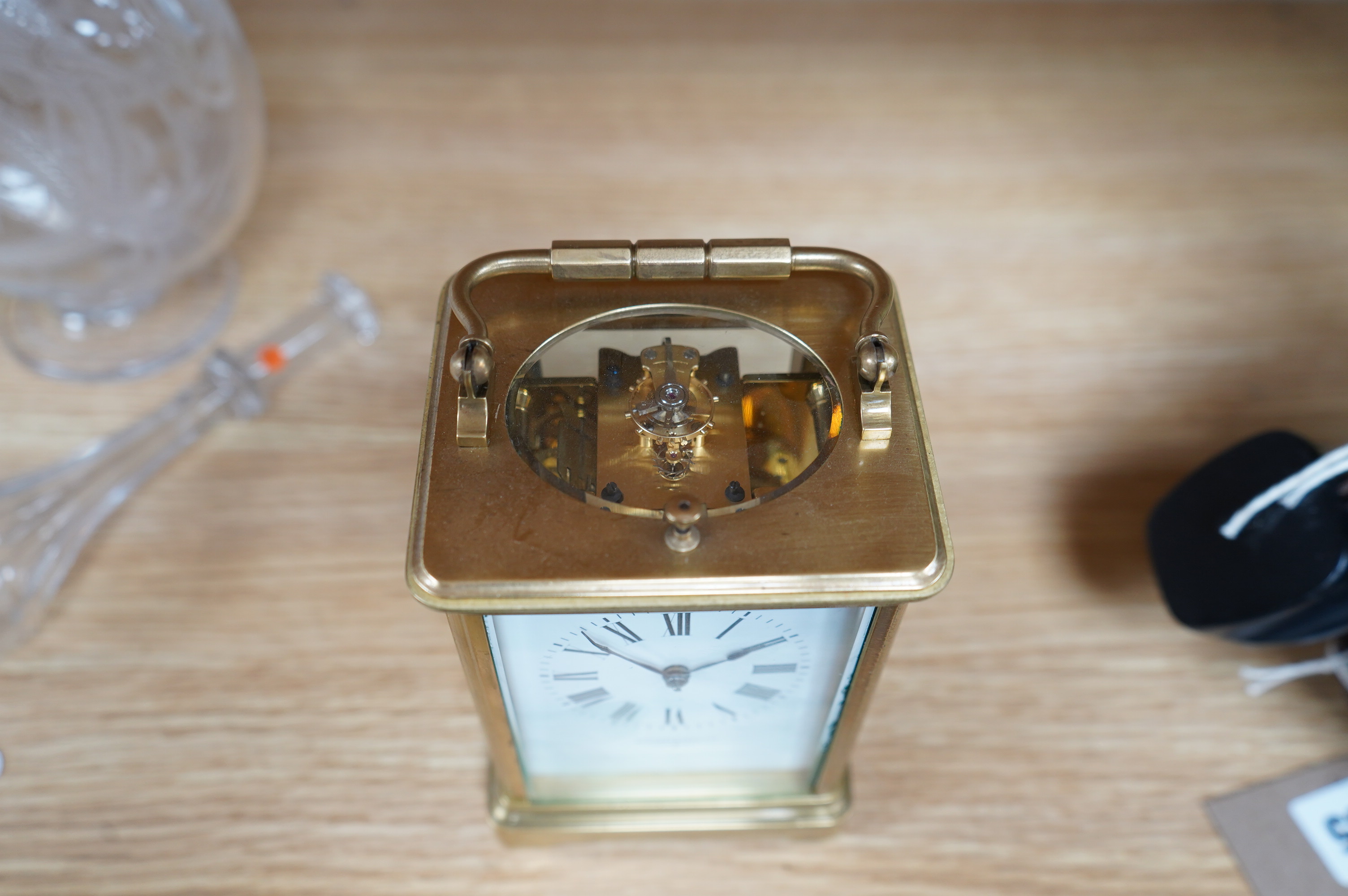 A brass cased repeating carriage clock, retailed by Edwards & Sons Ltd., no key, 15cm. Condition - fair to good, not tested